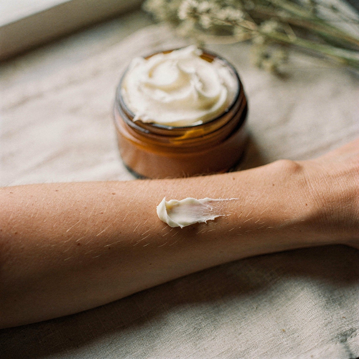 Patch testing a small dab of tallow body butter on the inside of a forearm.